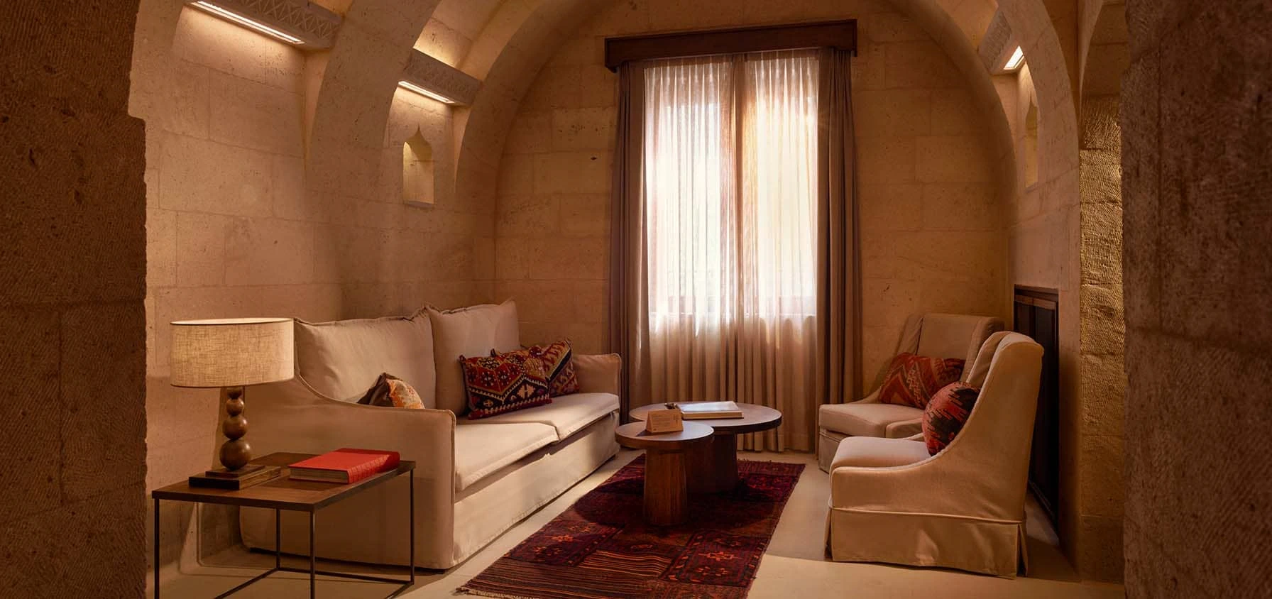 Argos in Cappadocia Suite warm stone bedroom