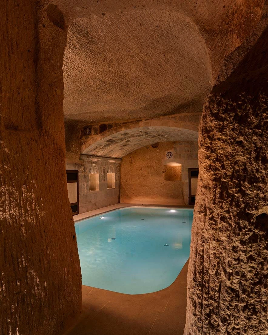 Indoor cave pool with turquoise water at Argos in Cappadocia