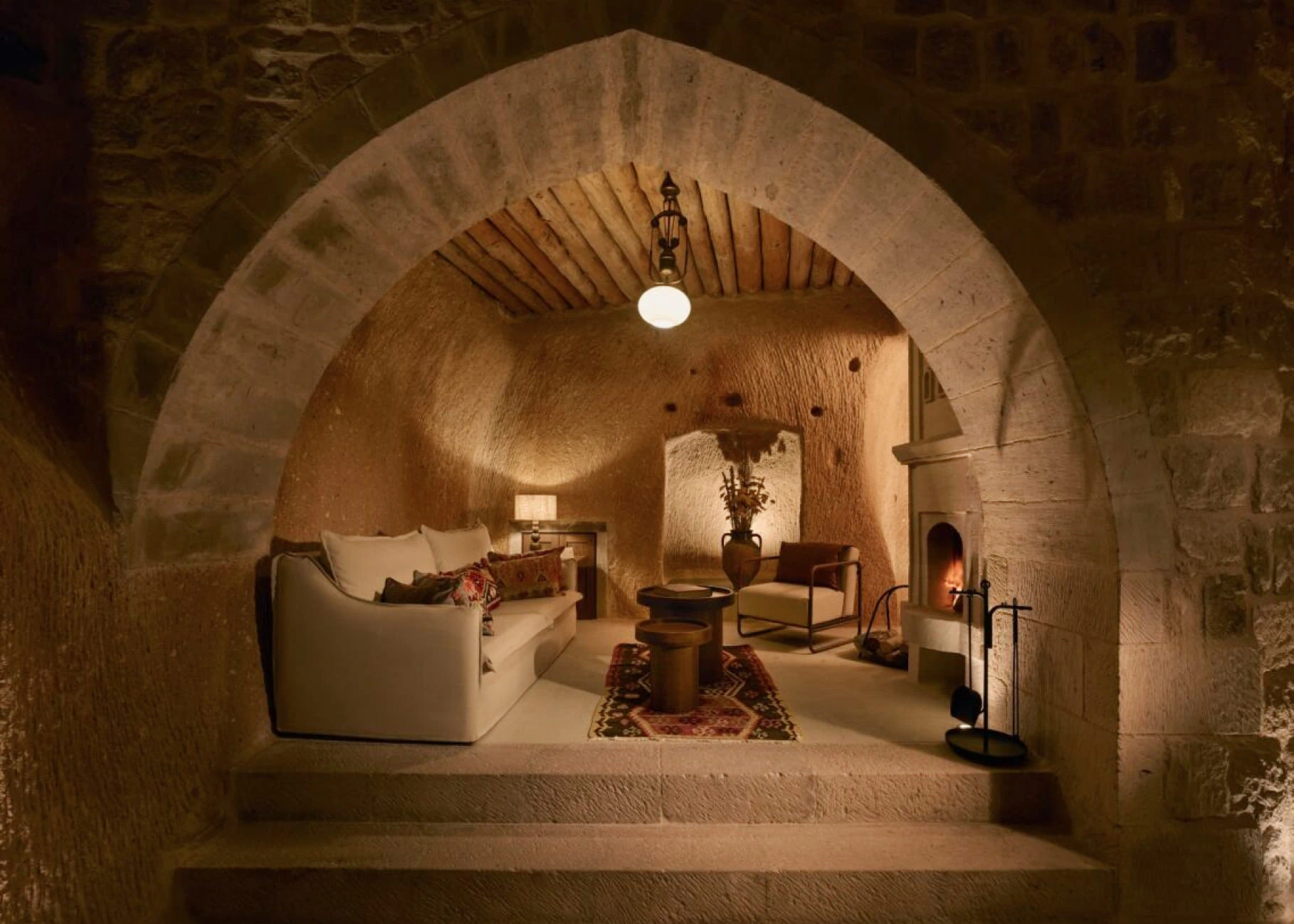 Wood door and stone arch in an Argos in Cappadocia cave room