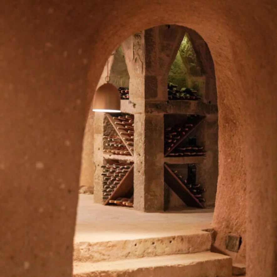 Warm stone lounge interior at Argos in Cappadocia cave hotel