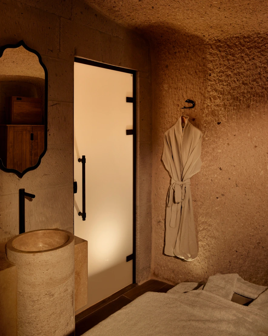 Stone-walled shower and wet area at Argos Spa, Argos in Cappadocia