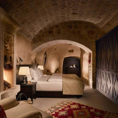 Arched stone bedroom in a cave suite at Argos in Cappadocia