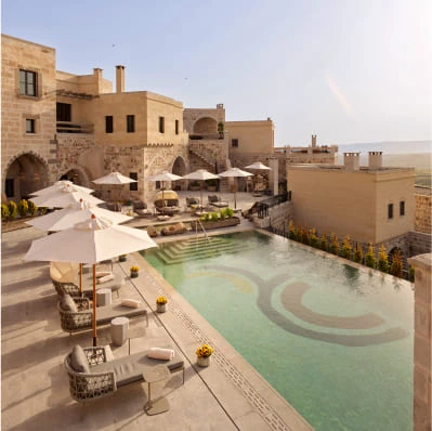 Stone terrace and pool with valley view at Argos in Cappadocia
