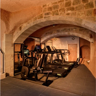 Argos Gym stone-arched fitness room at Argos in Cappadocia