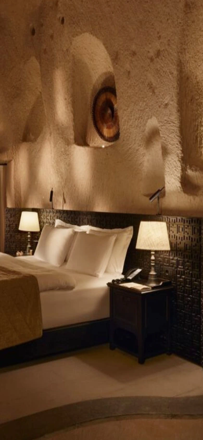 Argos in Cappadocia rooms mobile image of a stone bedroom