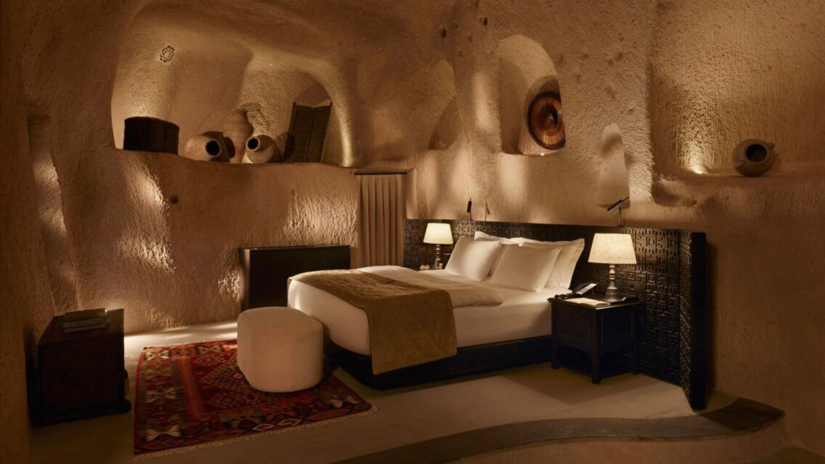 Argos in Cappadocia rooms mobile image of a stone bedroom