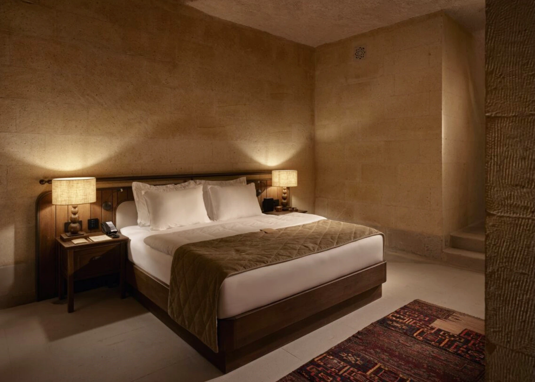 Cave room with wood-ceiling bed at Argos in Cappadocia